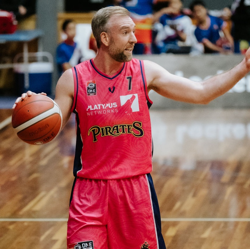 Najeal Young for the Rockhampton Rockers jumping into the air, preparing to dunk. 